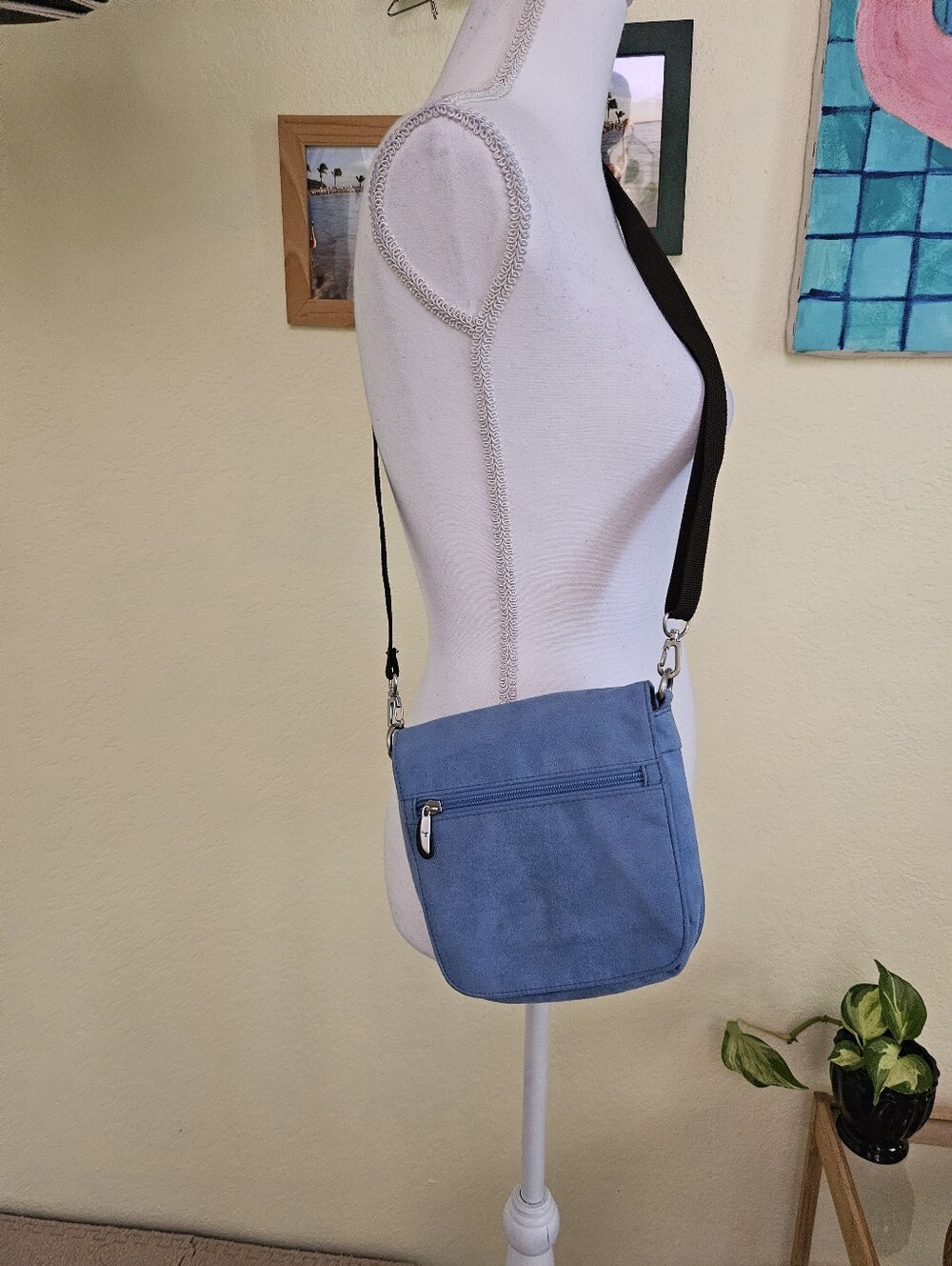 Travelon faux suede Cross body bag with belt wearing option.